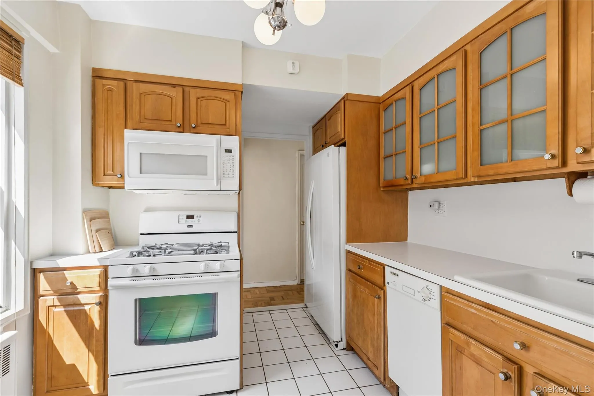 Windowed kitchen features dishwasher, microwave and refrigerator with water feature Windowed kitchen features dishwasher, microwave and refrigerator with water feature