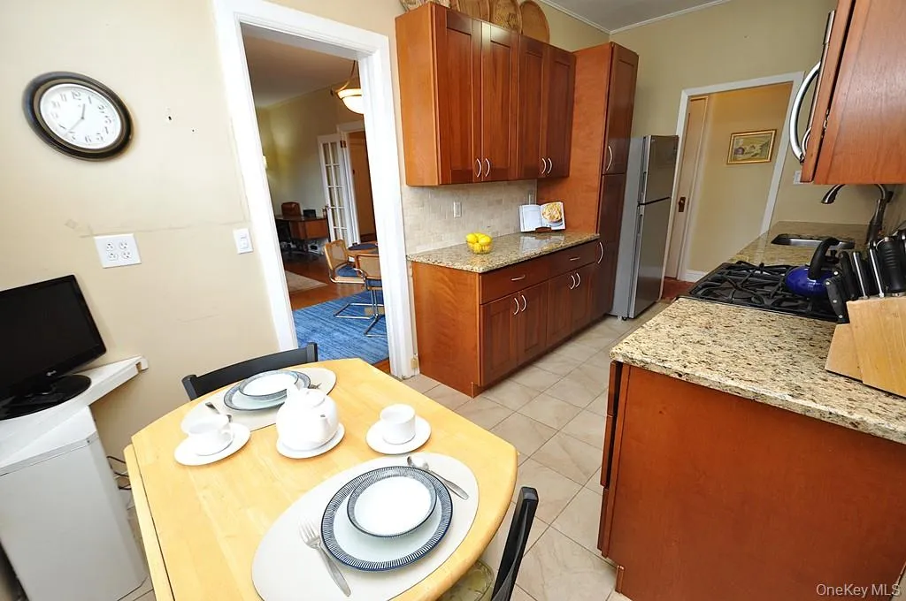 Renovated Eat-in-Kitchen has Granite Counters, Stainless Steel Appliances, Cherry Cabinets and a window for ventilation and natural light. Renovated Eat-in-Kitchen has Granite Counters, Stainless Steel Appliances, Cherry Cabinets and a window for ventilation and natural light.