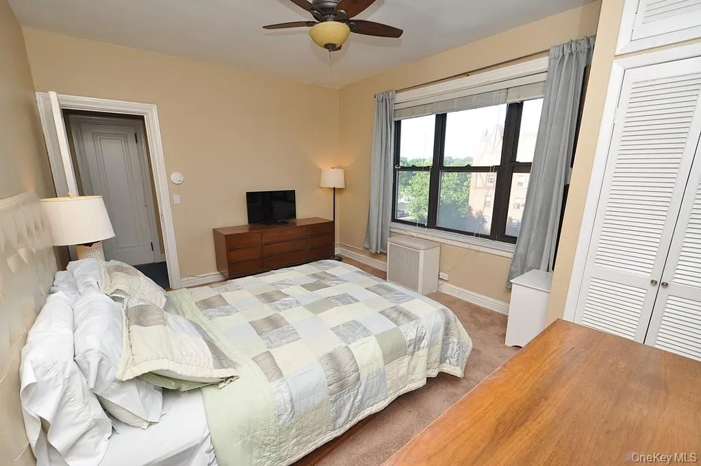 The corner bedroom overlooks tree lined Garth Road and has covered hardwood floors. The bedroom is approx. 14'-9" x 11'-7". The corner bedroom overlooks tree lined Garth Road and has covered hardwood floors. The bedroom is approx. 14'-9" x 11'-7".