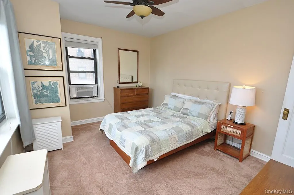 The corner bedroom overlooks tree lined Garth Road and has covered hardwood floors. The bedroom is approx. 14'-9" x 11'-7". The corner bedroom overlooks tree lined Garth Road and has covered hardwood floors. The bedroom is approx. 14'-9" x 11'-7".