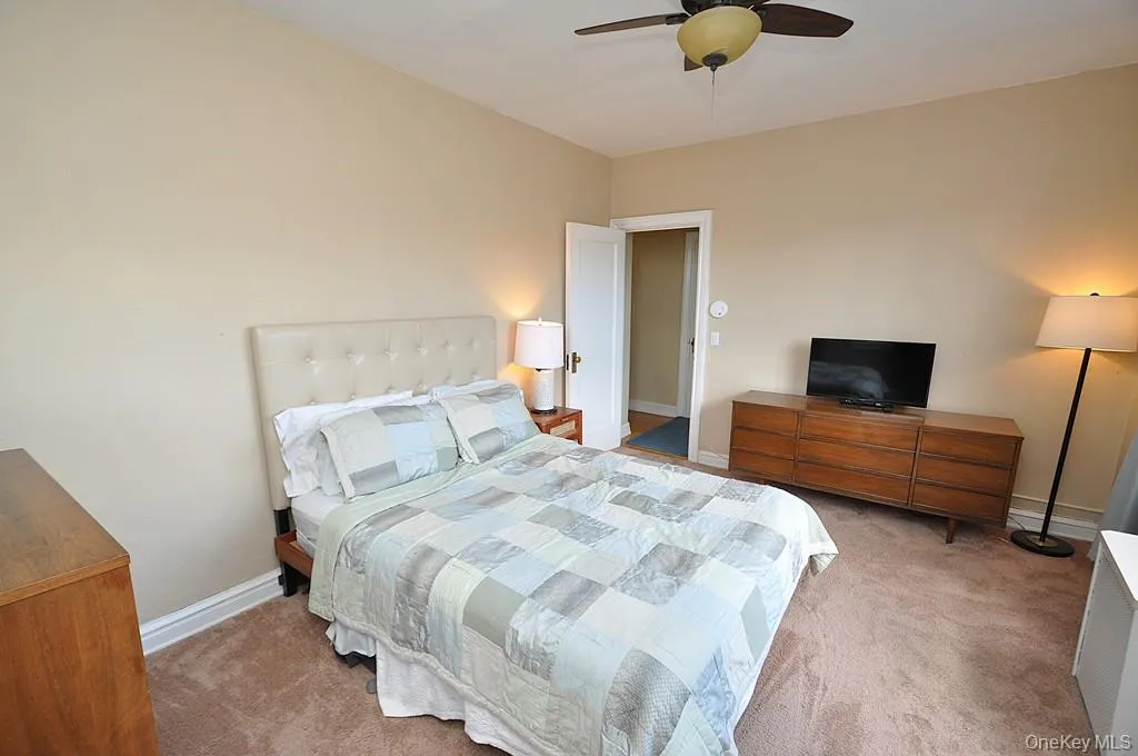 The corner bedroom overlooks tree lined Garth Road and has covered hardwood floors. The bedroom is approx. 14'-9" x 11'-7". The corner bedroom overlooks tree lined Garth Road and has covered hardwood floors. The bedroom is approx. 14'-9" x 11'-7".