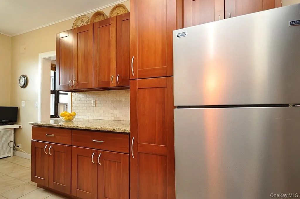Renovated Eat-in-Kitchen has Granite Counters, Stainless Steel Appliances, Cherry Cabinets and a window for ventilation and natural light. Renovated Eat-in-Kitchen has Granite Counters, Stainless Steel Appliances, Cherry Cabinets and a window for ventilation and natural light.