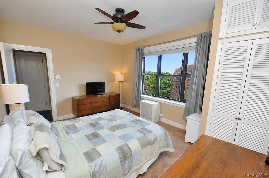 The corner bedroom overlooks tree lined Garth Road and has covered hardwood floors. The bedroom is approx. 14'-9" x 11'-7". The corner bedroom overlooks tree lined Garth Road and has covered hardwood floors. The bedroom is approx. 14'-9" x 11'-7".