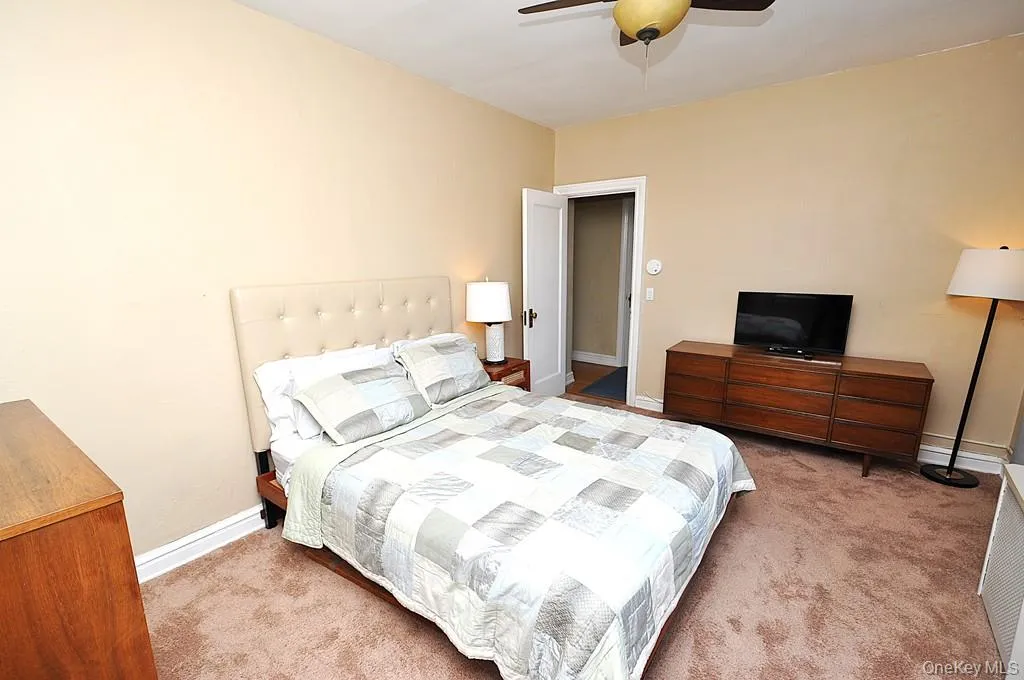 The corner bedroom overlooks tree lined Garth Road and has covered hardwood floors. The bedroom is approx. 14'-9" x 11'-7". The corner bedroom overlooks tree lined Garth Road and has covered hardwood floors. The bedroom is approx. 14'-9" x 11'-7".