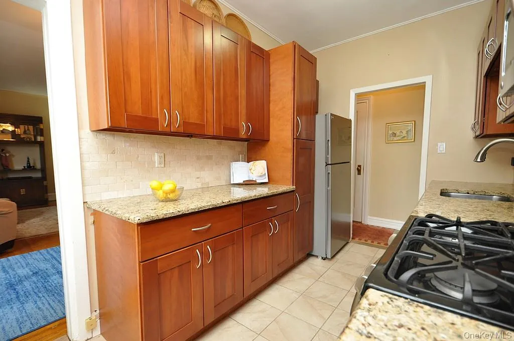 Renovated Eat-in-Kitchen has Granite Counters, Stainless Steel Appliances, Cherry Cabinets and a window for ventilation and natural light. Renovated Eat-in-Kitchen has Granite Counters, Stainless Steel Appliances, Cherry Cabinets and a window for ventilation and natural light.
