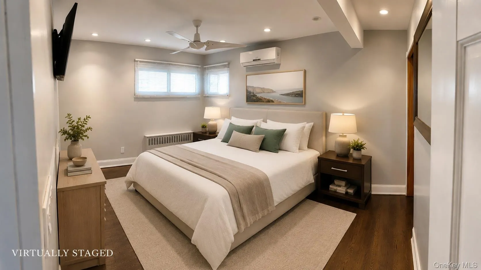 Primary bedroom with walk in closet and Hardwood-style flooring throughout Primary bedroom with walk in closet and Hardwood-style flooring throughout