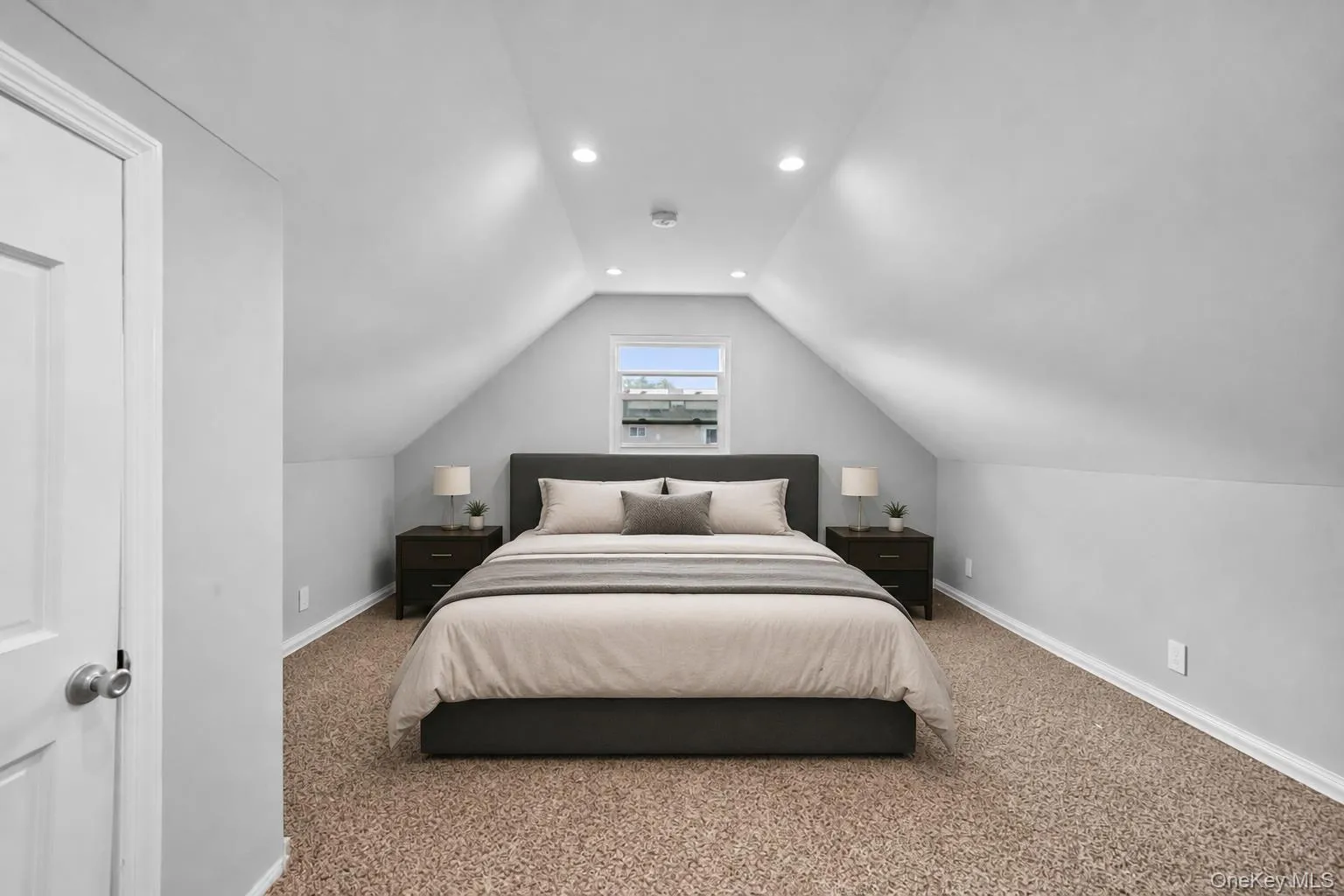 Upstairs room featuring a window, recessed lighting, white baseboards, light grey walls, and light brown carpeting Upstairs room featuring a window, recessed lighting, white baseboards, light grey walls, and light brown carpeting