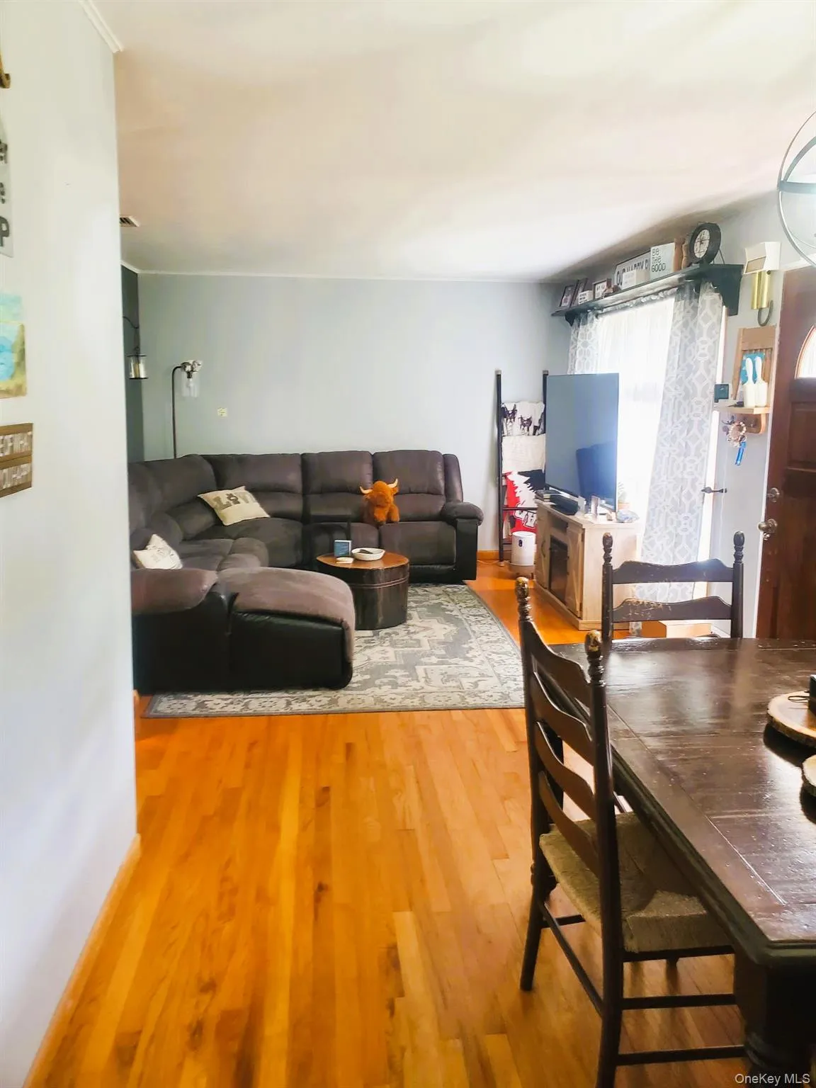 Hardwood flooring extending from the foreground into an open living area Hardwood flooring extending from the foreground into an open living area