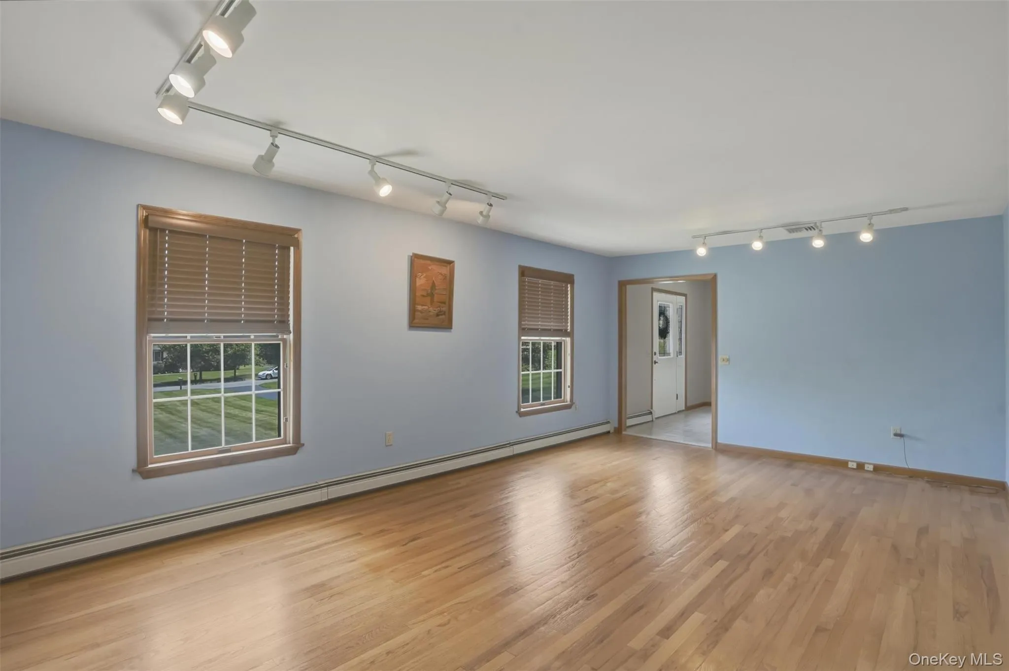 Same formal living room with hardwood floors Same formal living room with hardwood floors