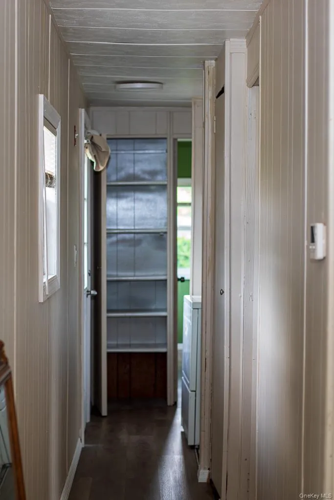 hall to bedrooms and bath, includes laundry area and storage hall to bedrooms and bath, includes laundry area and storage