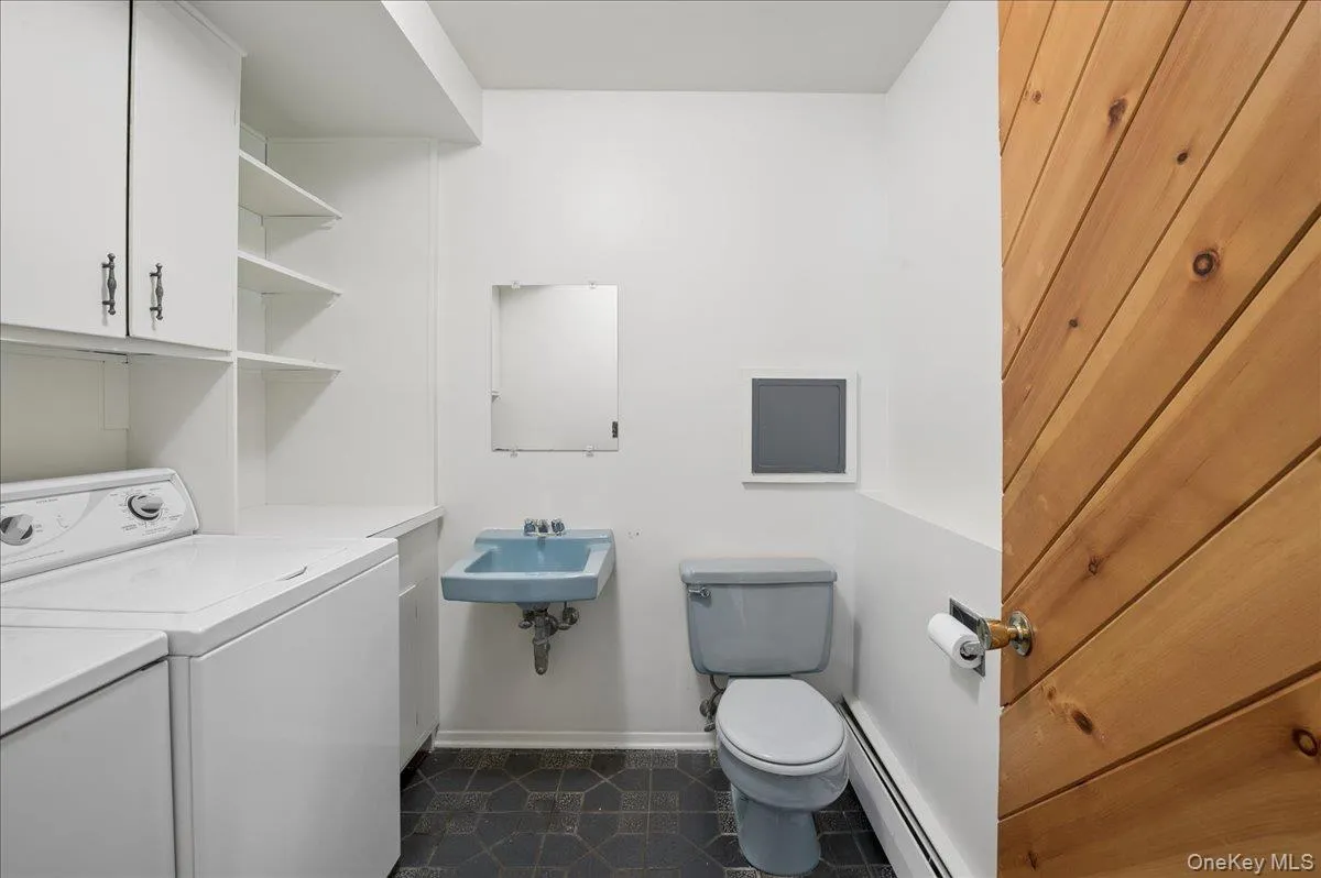 Lower level powder room with laundry. Lower level powder room with laundry.
