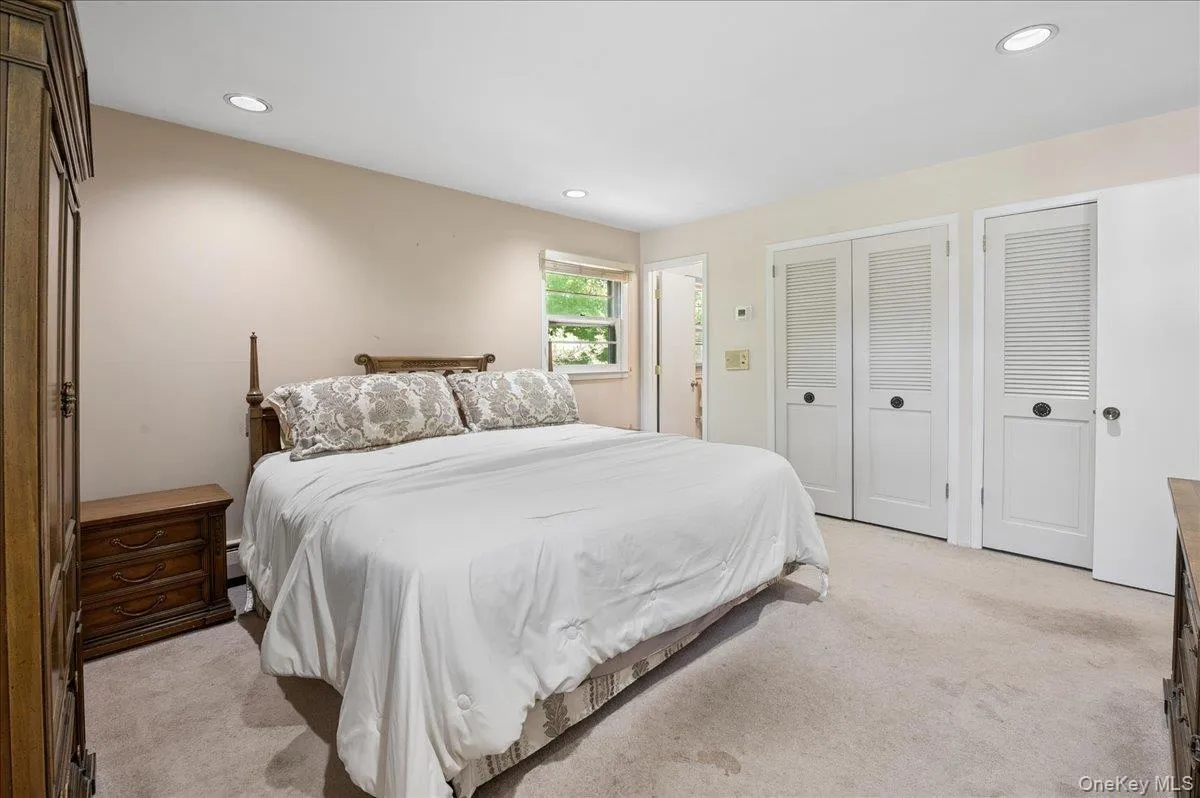 Spacious primary bedroom with double closets and en-suite bath. Spacious primary bedroom with double closets and en-suite bath.