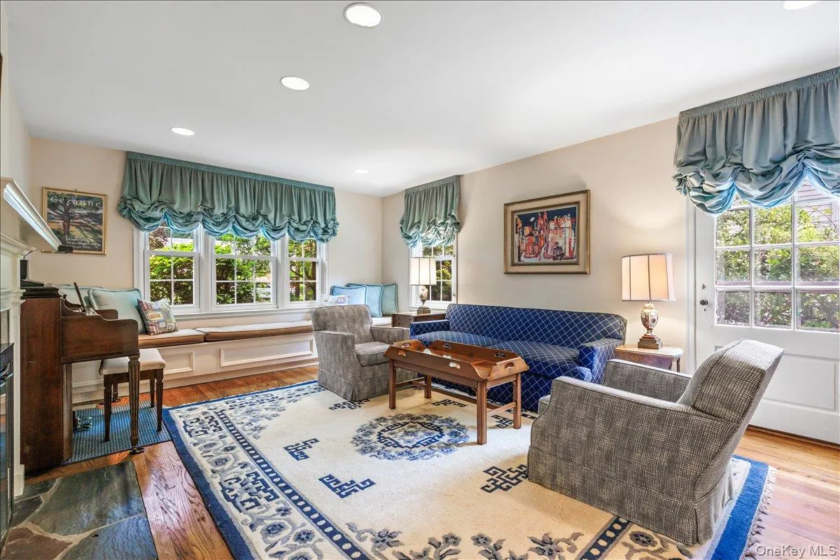 Living room has lots of light and side door. Living room has lots of light and side door.