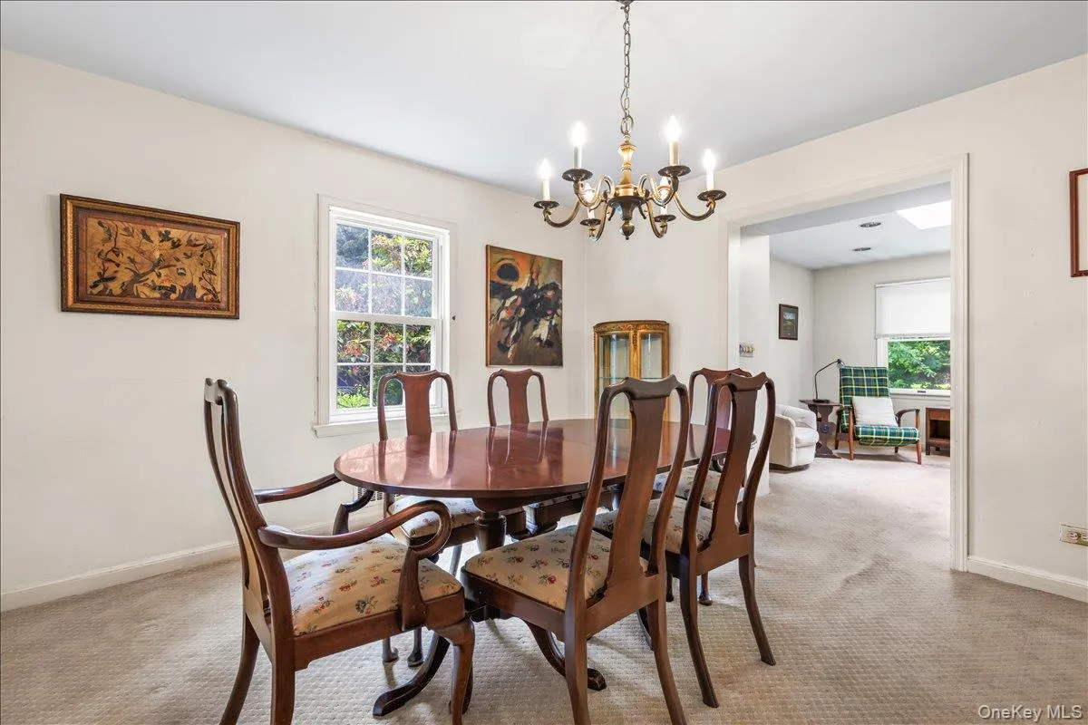 Spacious dining room leads to den. Spacious dining room leads to den.