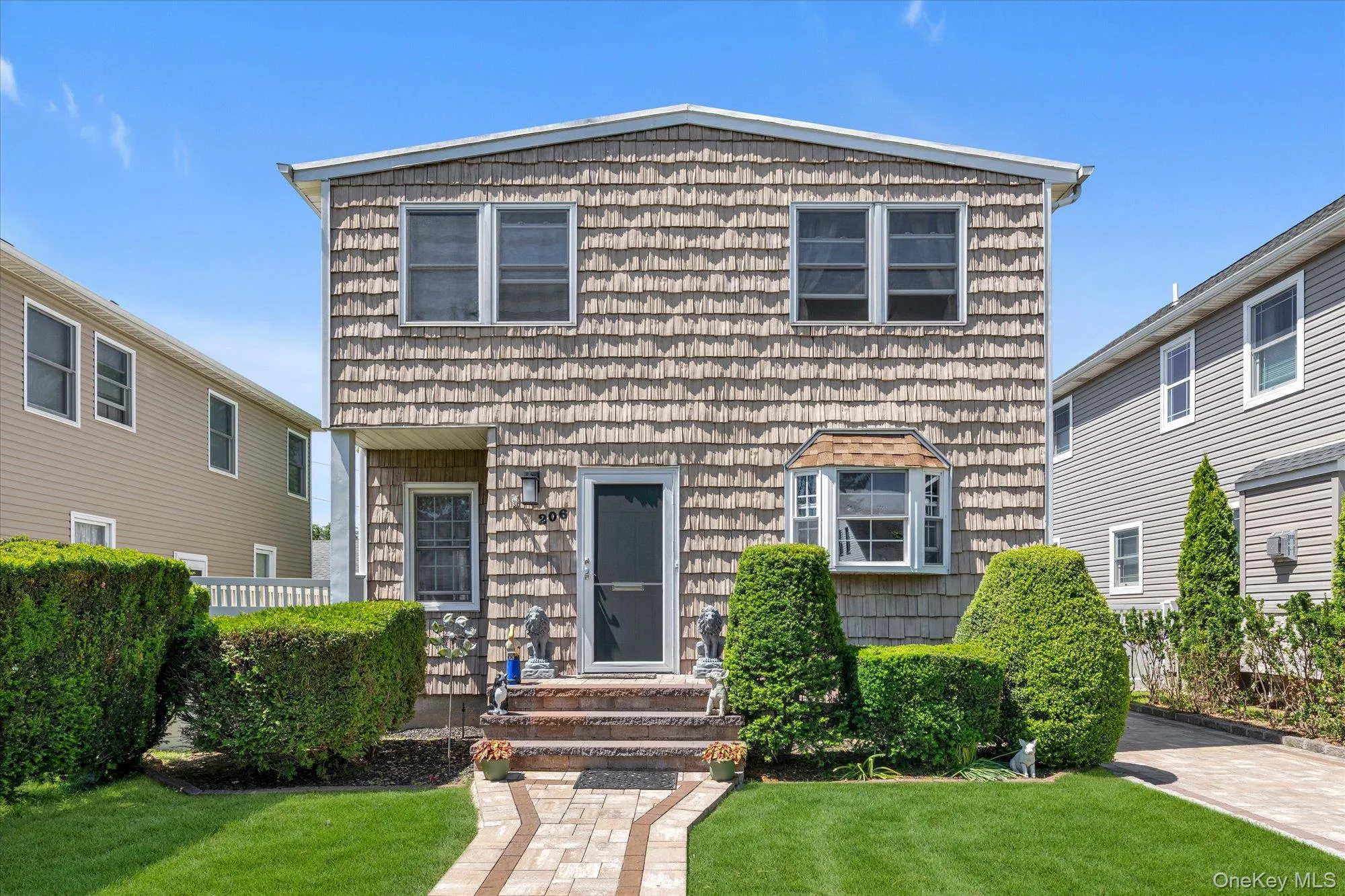 Two-story residence with front walkway. Two-story residence with front walkway.