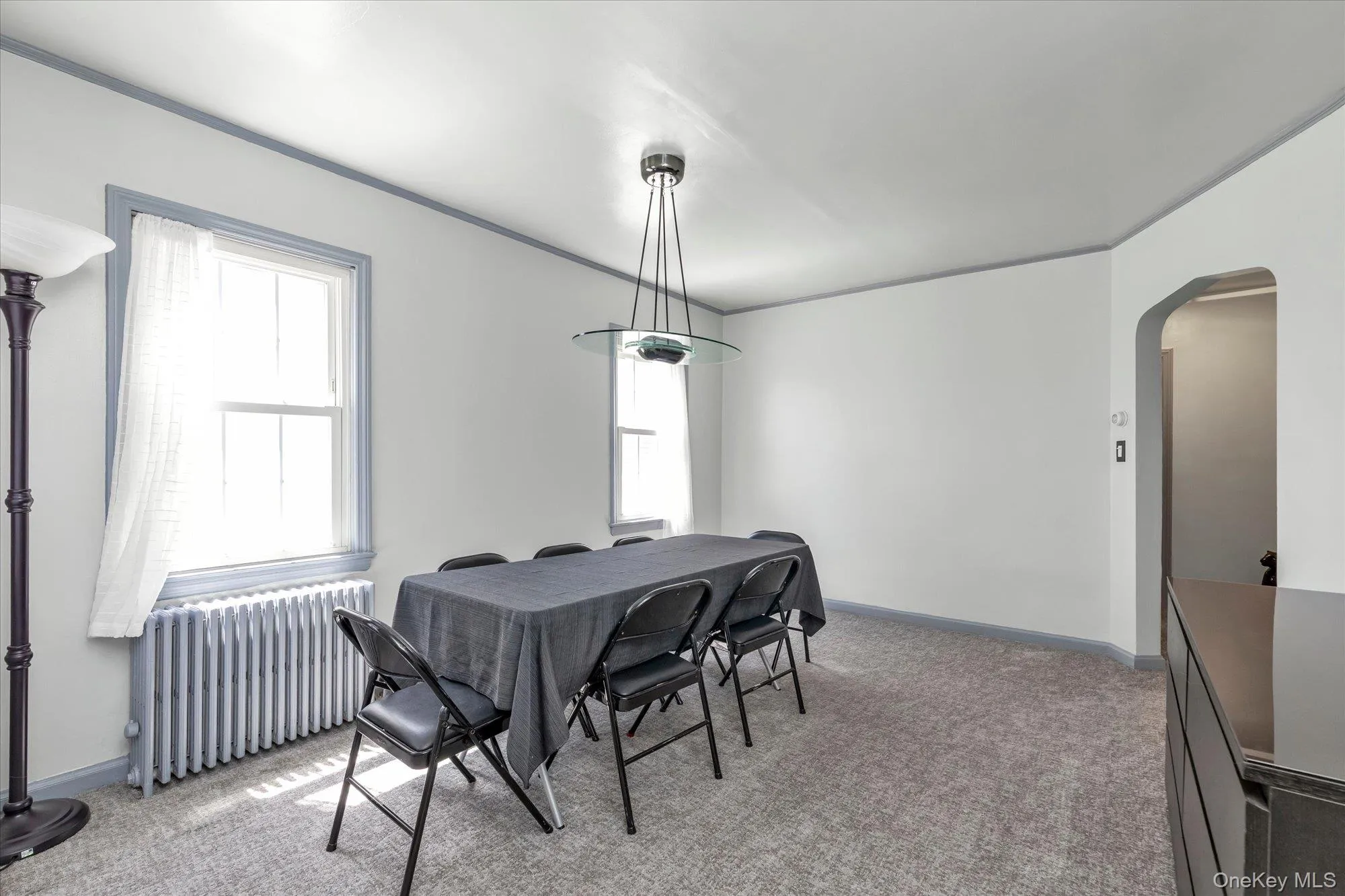Spacious room featuring newly painted walls, trim, and new carpet. Spacious room featuring newly painted walls, trim, and new carpet.
