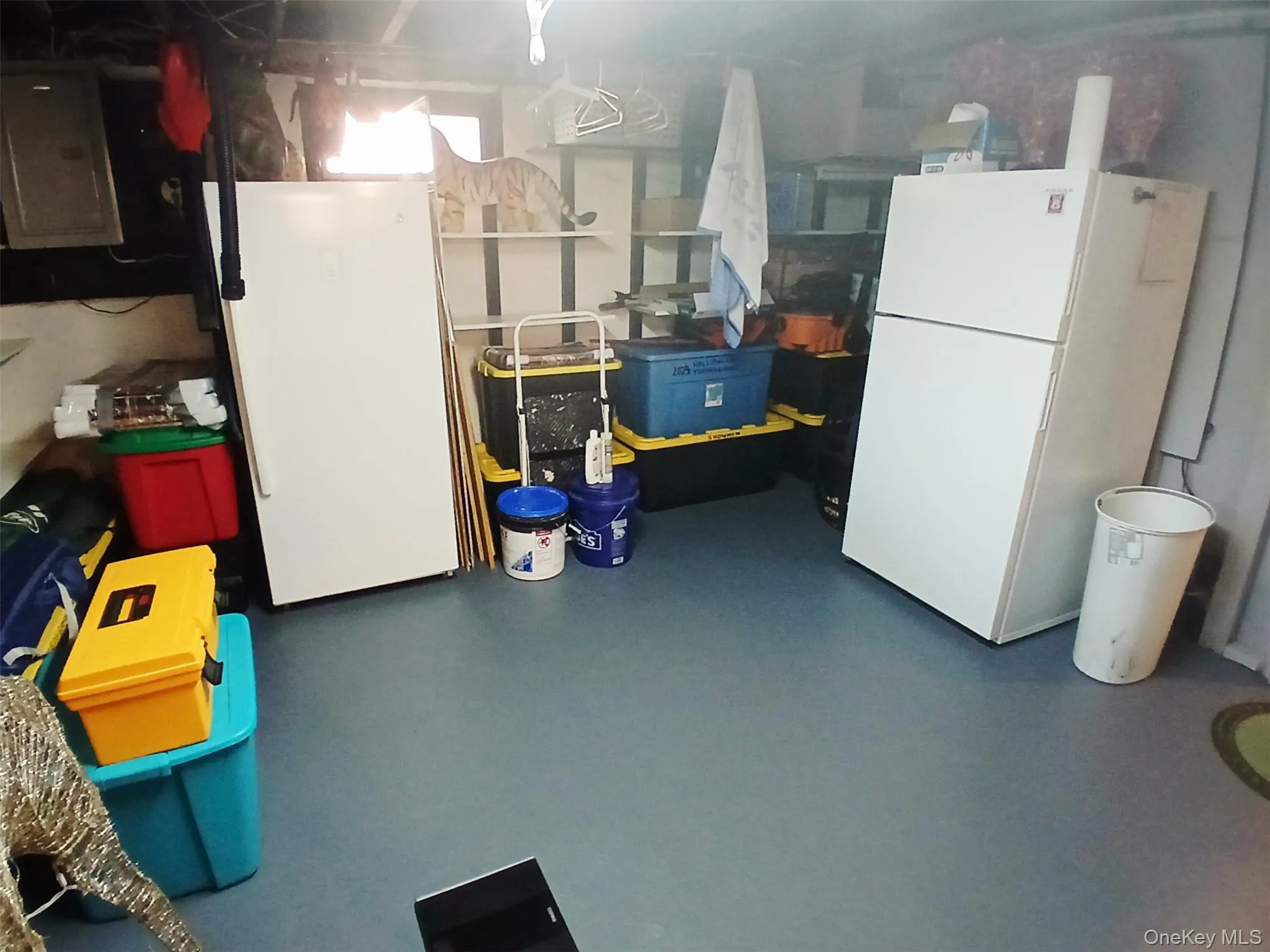 Utility area with additional refrigerator and freezer. Utility area with additional refrigerator and freezer.