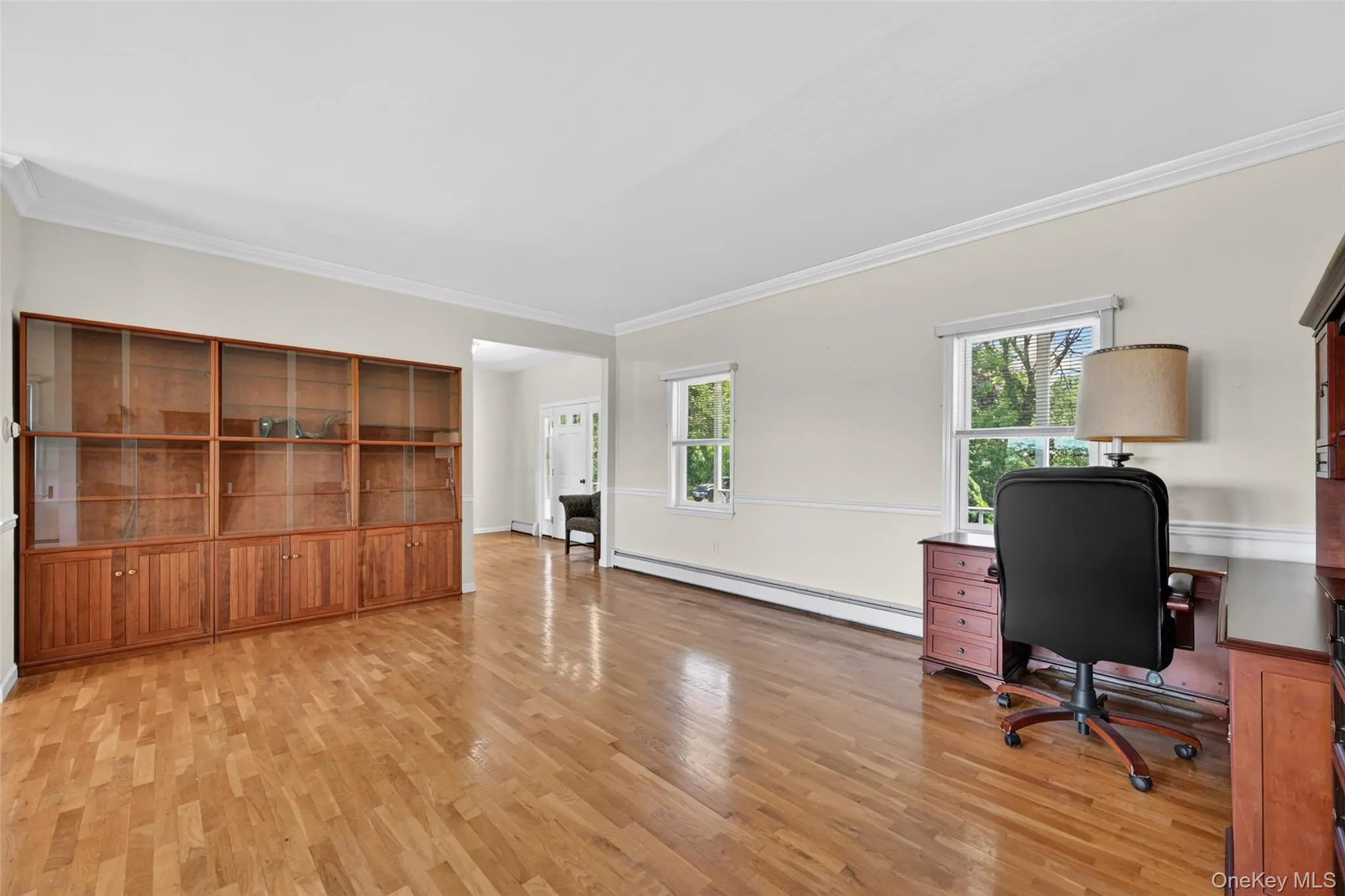 Hardwood flooring throughout a spacious room Hardwood flooring throughout a spacious room