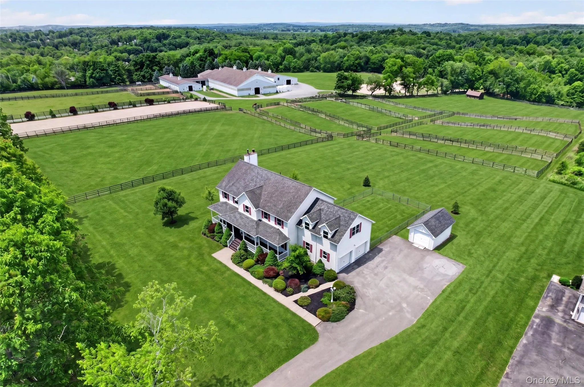 Expansive estate featuring a two-story residence with attached garage, Expansive estate featuring a two-story residence with attached garage,