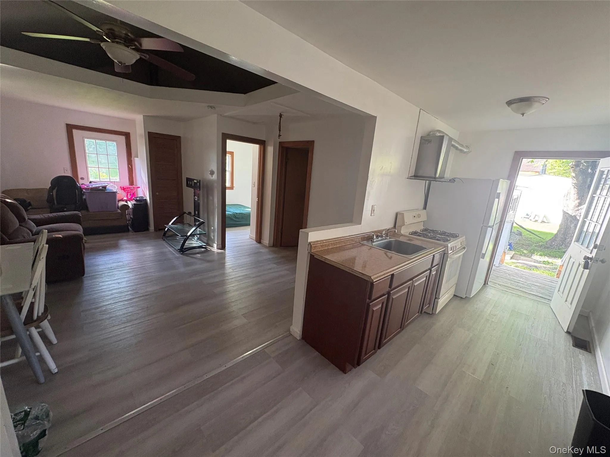 Open-concept living area with abundant natural light. Open-concept living area with abundant natural light.
