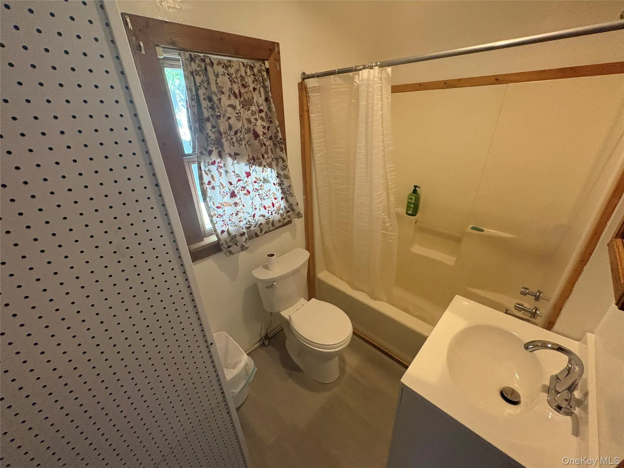 Full bathroom with tub and shower combination. Full bathroom with tub and shower combination.