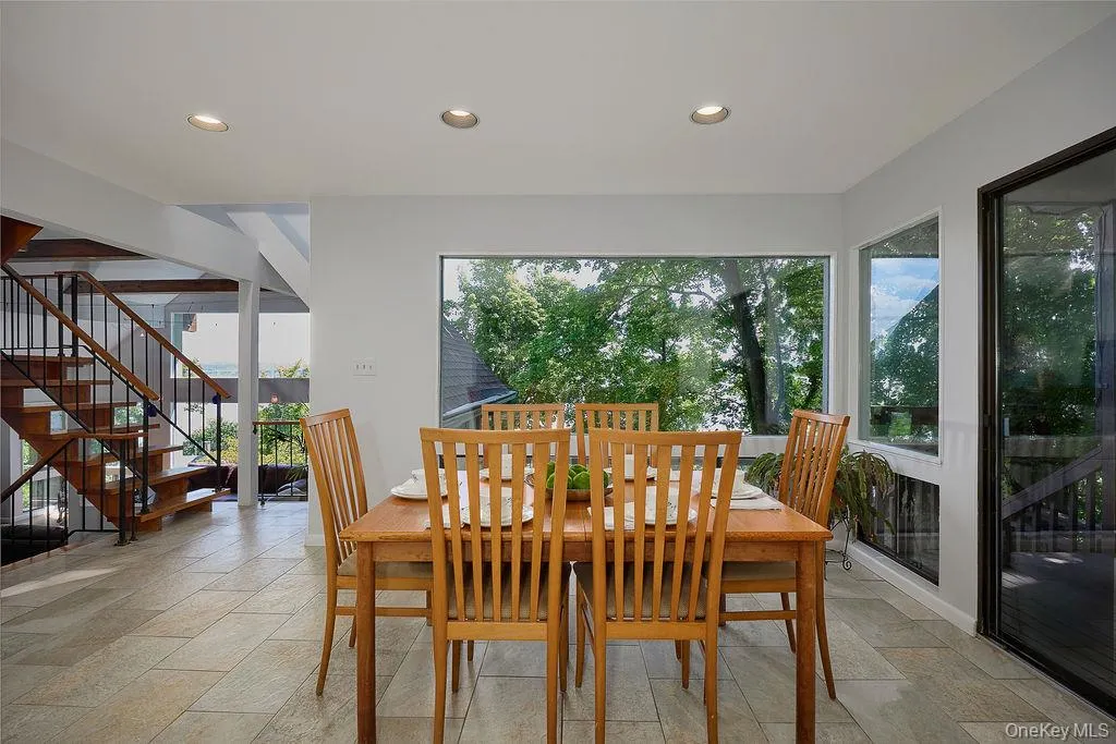 Dining area featuring recessed lighting, and tile flooring Dining area featuring recessed lighting, and tile flooring