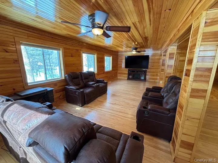 Spacious room featuring pine tongue and groove on walls and ceiling Spacious room featuring pine tongue and groove on walls and ceiling
