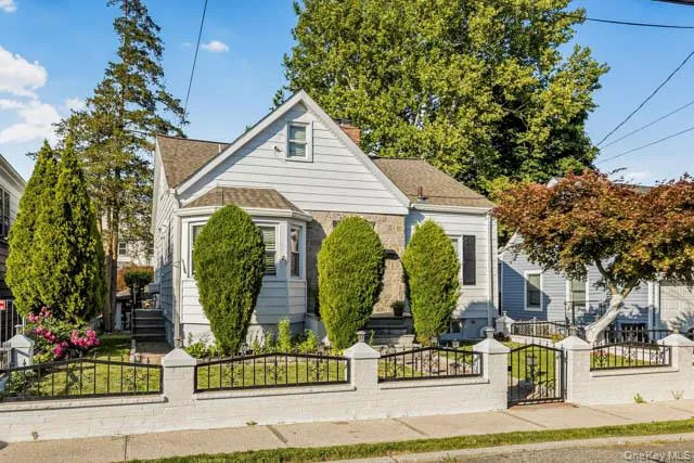 Charming single-family home featuring a partial stone facade and light-colored siding Charming single-family home featuring a partial stone facade and light-colored siding