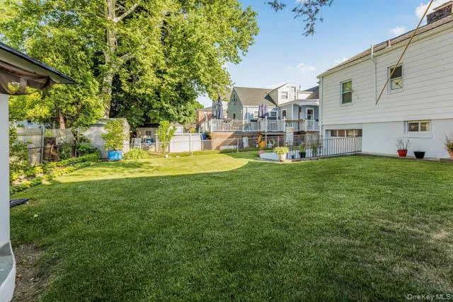 Expansive green lawn with mature perimeter trees Expansive green lawn with mature perimeter trees