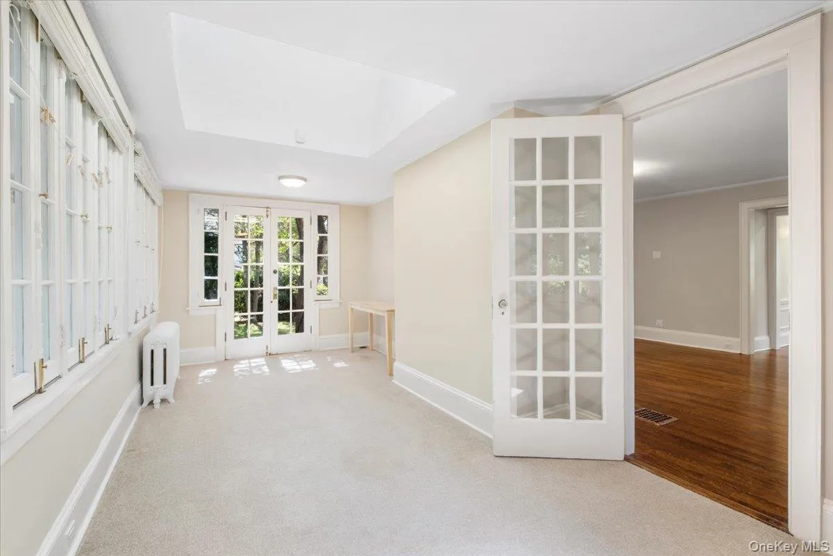 Sun room/family room with French doors to the back yard Sun room/family room with French doors to the back yard