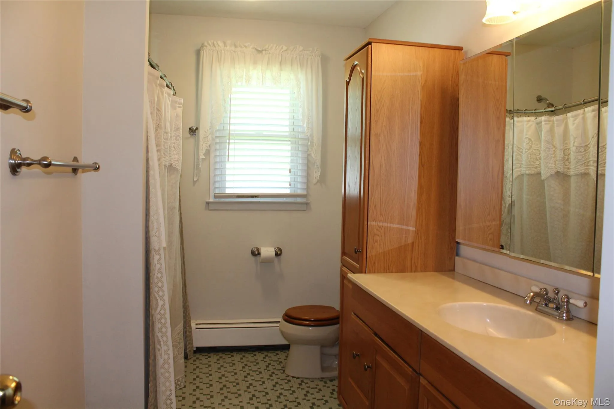 Large Full Bathroom/ Tub with Vanity and storage cabinetry. Tile Floor. Large Full Bathroom/ Tub with Vanity and storage cabinetry. Tile Floor.