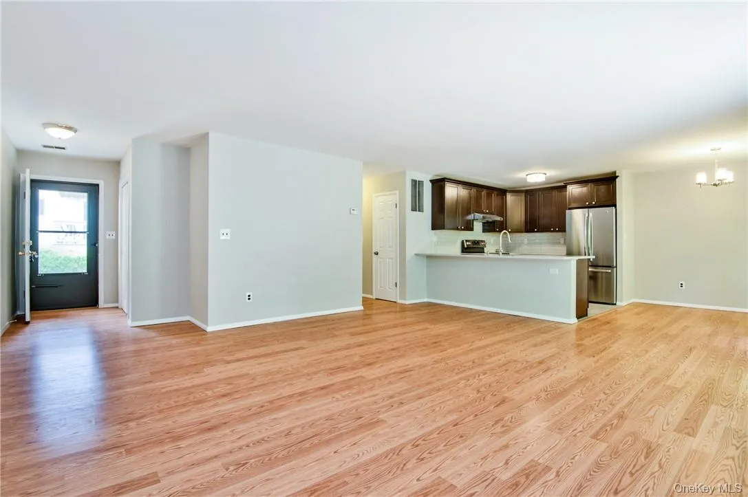 Open floor plan with hardwood floors throughout. Open floor plan with hardwood floors throughout.