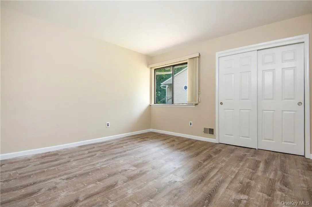2nd bedroom with large closets and beautiful engineered wood floors. 2nd bedroom with large closets and beautiful engineered wood floors.