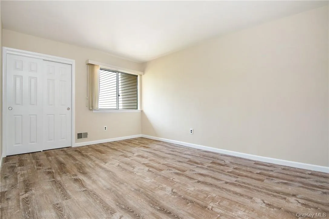 Primary bedroom with large closets, beautiful engineered hard wood floors and en-suite bathroom. Primary bedroom with large closets, beautiful engineered hard wood floors and en-suite bathroom.