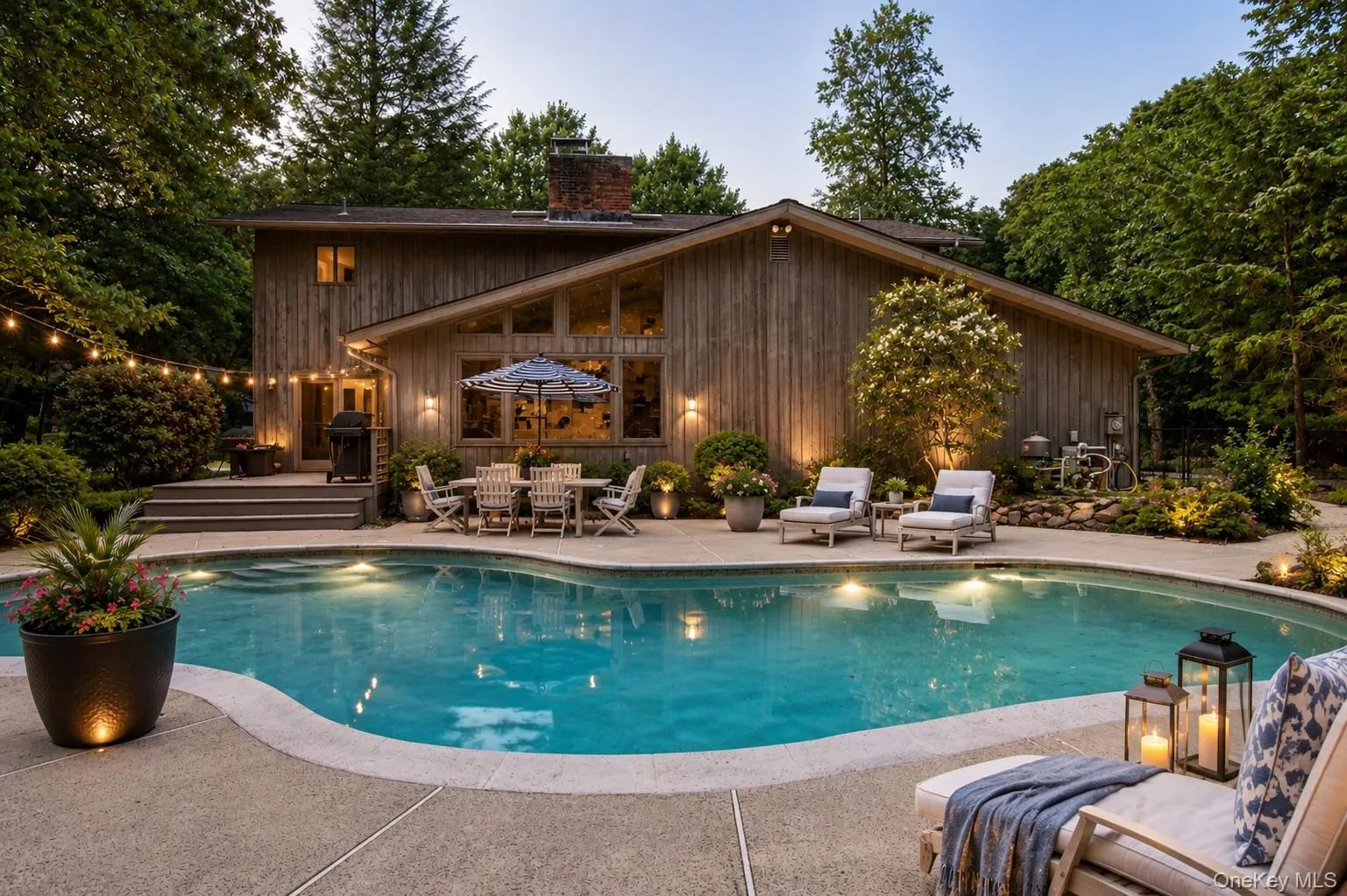 Surrounded by mature trees and lush landscaping, this resort-style backyard features an inviting in-ground pool, expansive patio space for lounging and entertaining, and multiple spots to relax in the sun or shade. Surrounded by mature trees and lush landscaping, this resort-style backyard features an inviting in-ground pool, expansive patio space for lounging and entertaining, and multiple spots to relax in the sun or shade.