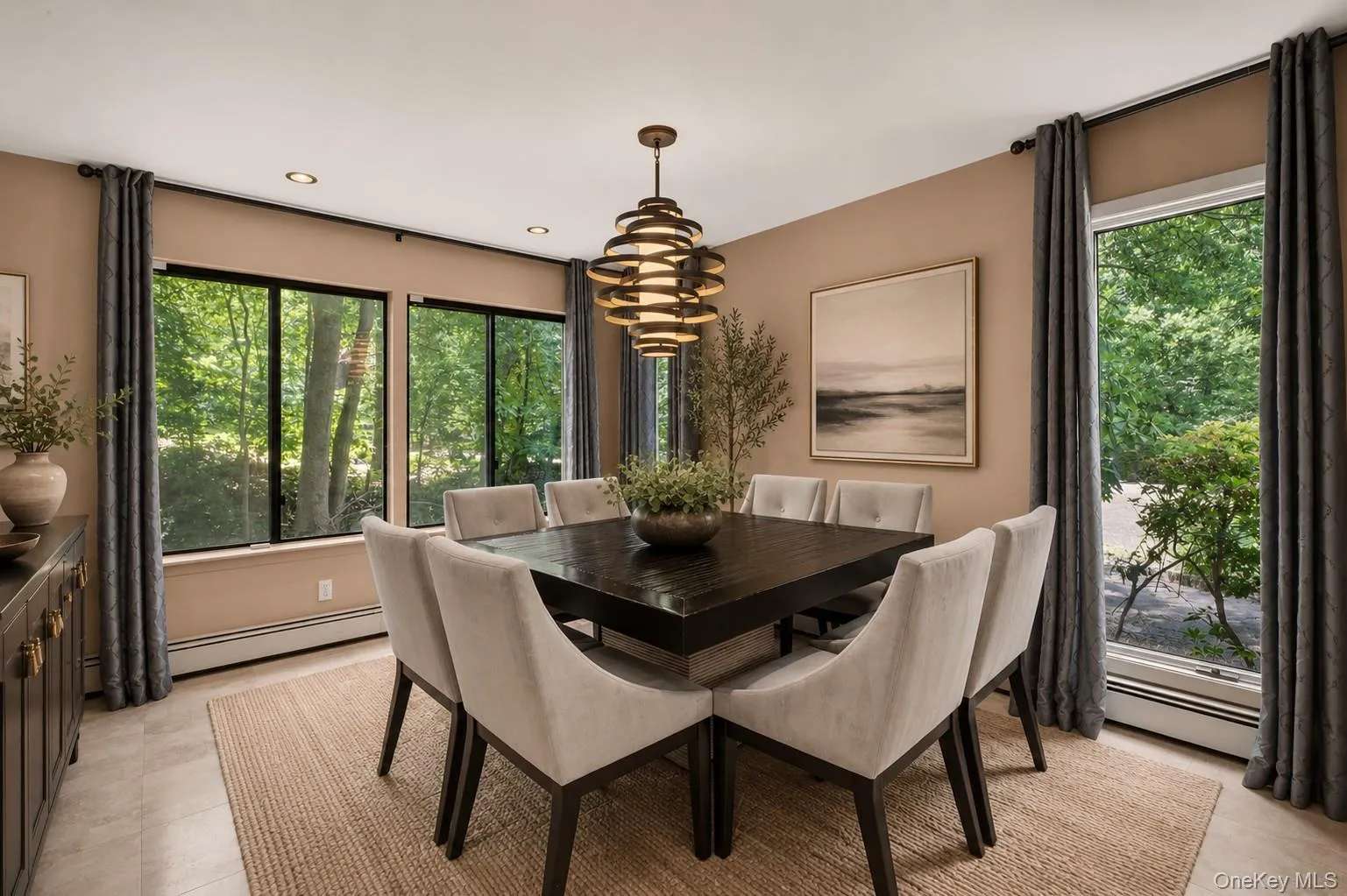 The formal dining room is highlighted by three oversized windows that flood the space with natural light and showcase picturesque views of the surrounding property, creating a bright and elegant backdrop for entertaining. The formal dining room is highlighted by three oversized windows that flood the space with natural light and showcase picturesque views of the surrounding property, creating a bright and elegant backdrop for entertaining.