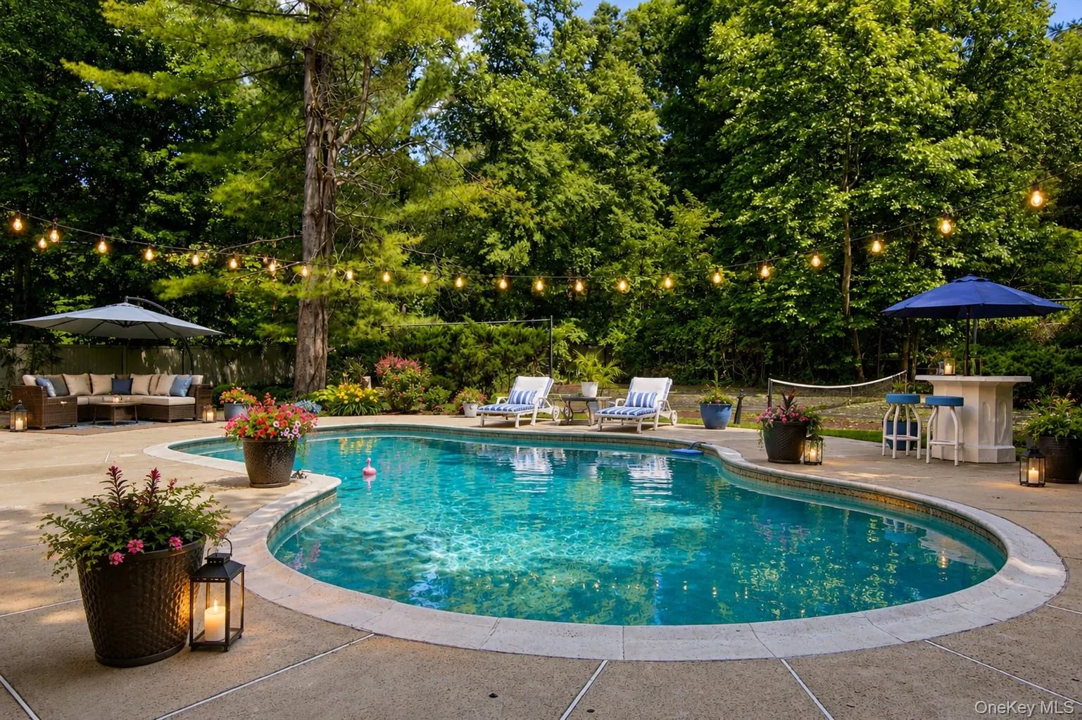 Enjoy endless summer days in the heated gunite pool, complete with a custom diving platform and surrounded by an expansive Kool Deck patio designed to stay cool underfoot on hot summer days. Enjoy endless summer days in the heated gunite pool, complete with a custom diving platform and surrounded by an expansive Kool Deck patio designed to stay cool underfoot on hot summer days.