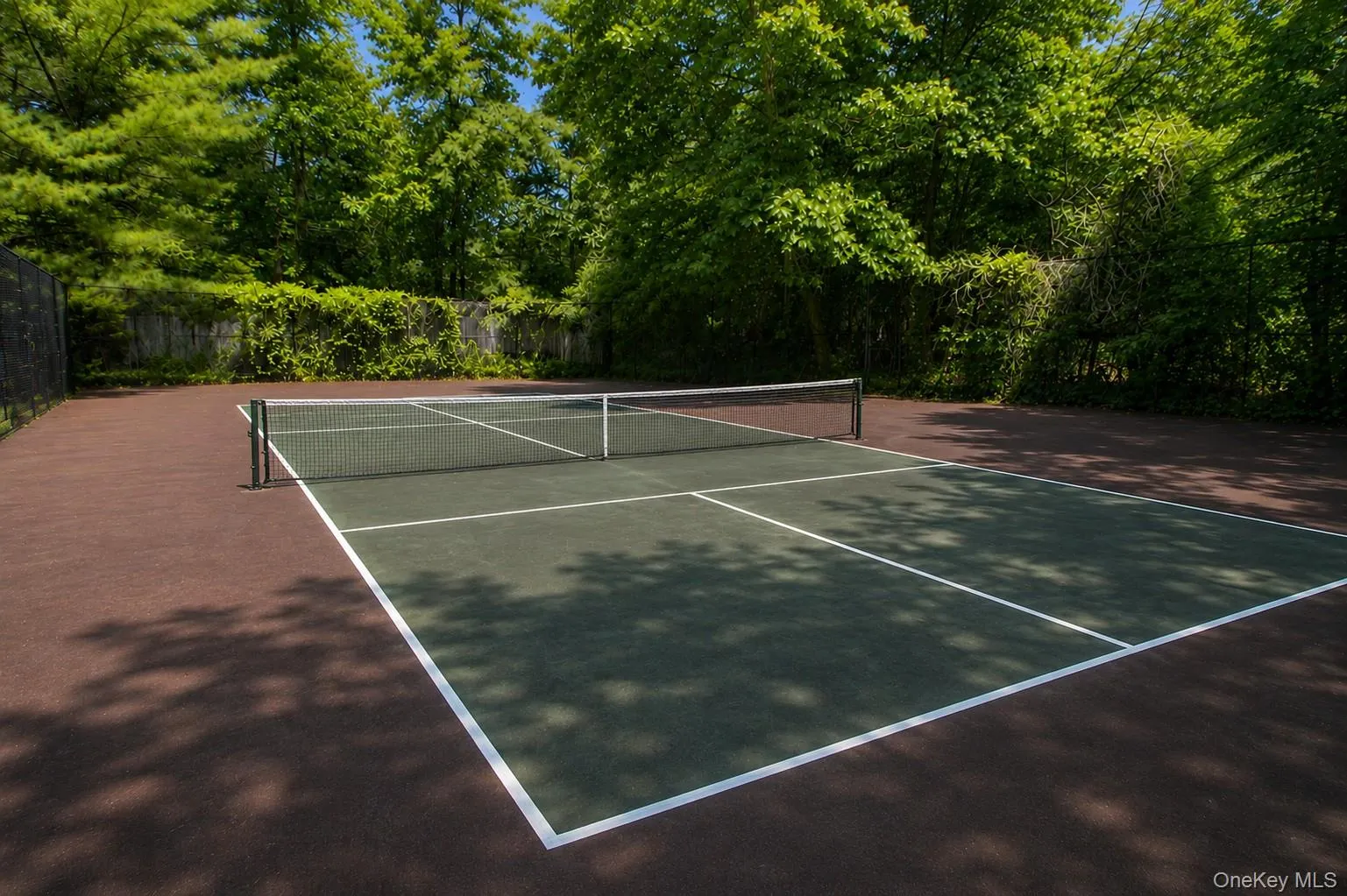 Virtually enhanced image. This AI-generated rendering is intended to illustrate the potential appearance of a Pickleball Court following resurfacing and cosmetic improvements. Virtually enhanced image. This AI-generated rendering is intended to illustrate the potential appearance of a Pickleball Court following resurfacing and cosmetic improvements.