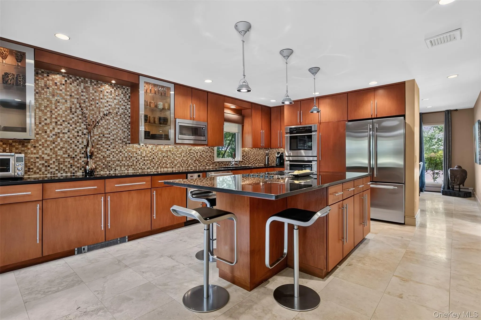 Designed with both form and function in mind, the chef's kitchen offers generous space for cooking, gathering, and entertaining. Designed with both form and function in mind, the chef's kitchen offers generous space for cooking, gathering, and entertaining.