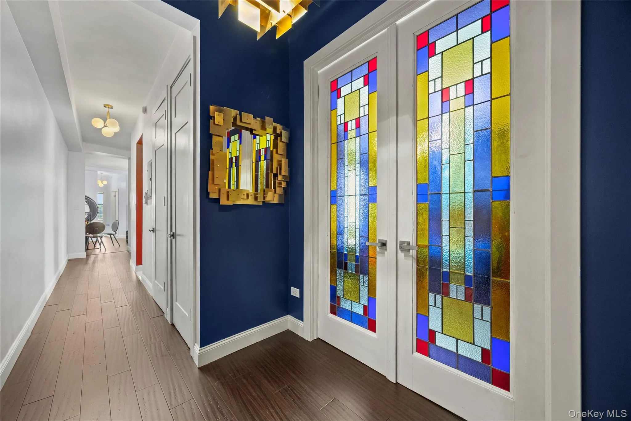 Designed stained glass door to the primary bedroom. Hall gallery. Designed stained glass door to the primary bedroom. Hall gallery.