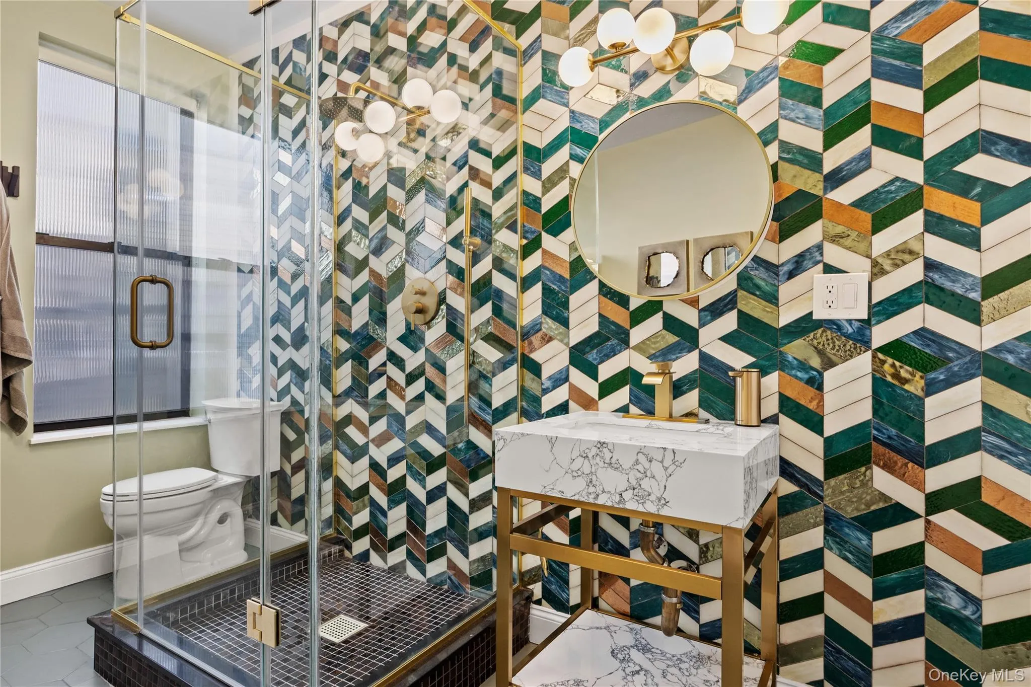 Spa like space featuring shower and vibrant tile Spa like space featuring shower and vibrant tile