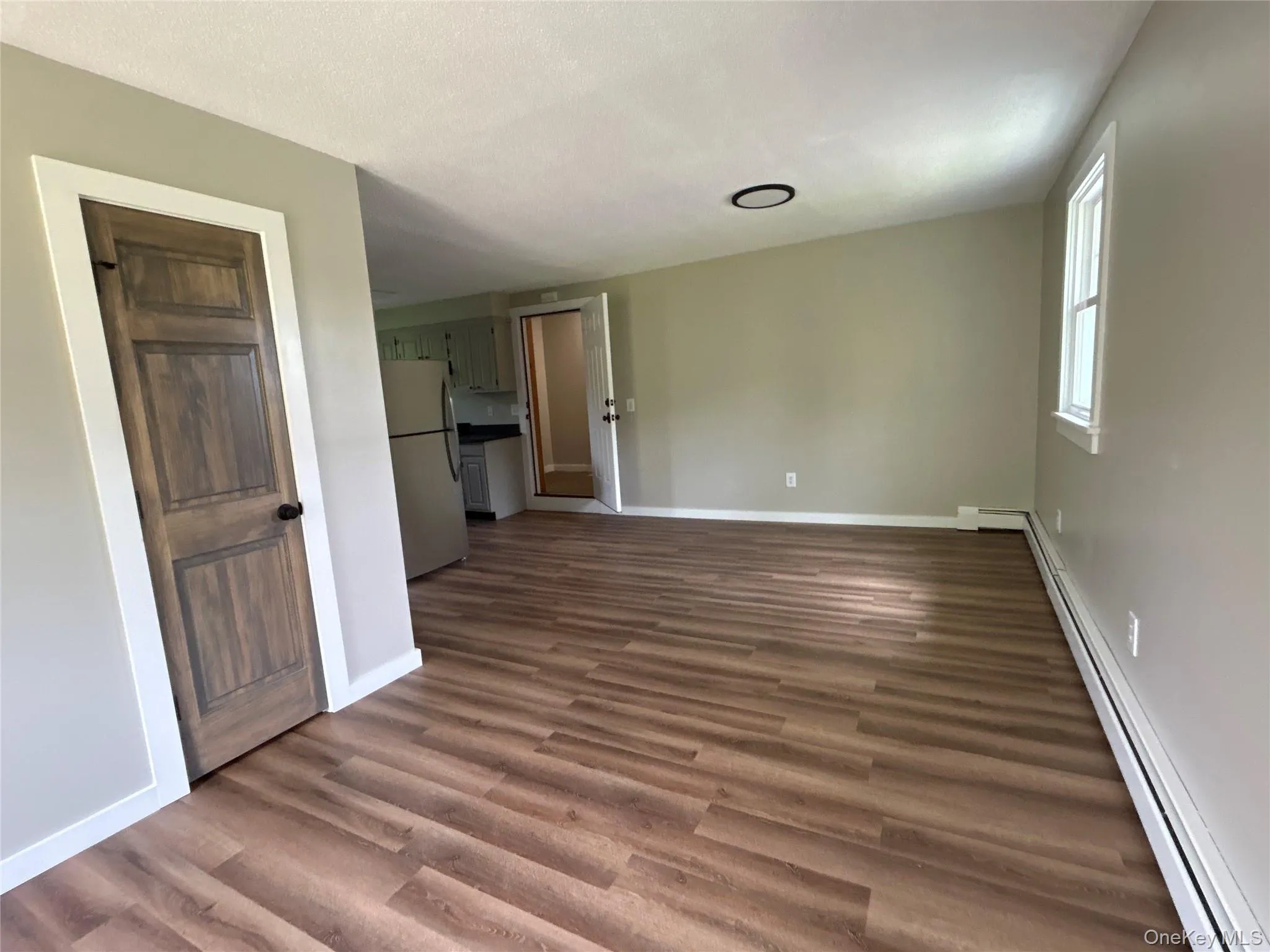 Second floor one bedroom apartment #3 view into dining and living room area Second floor one bedroom apartment #3 view into dining and living room area