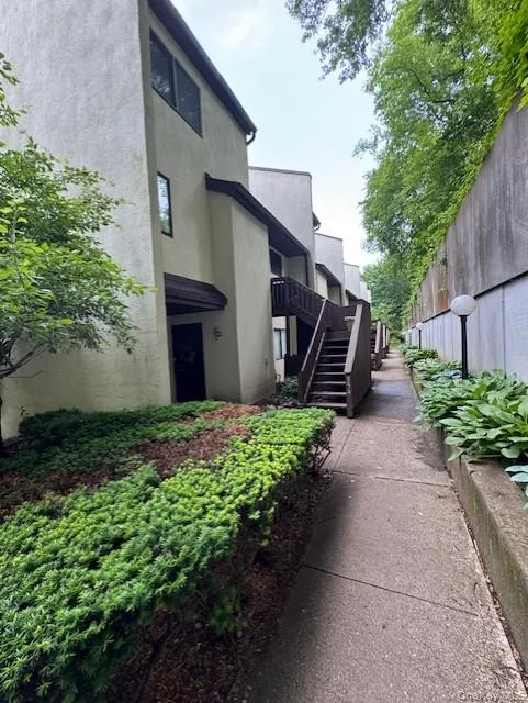 View of home's community with stairway View of home's community with stairway