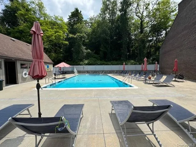 Community pool with a patio Community pool with a patio