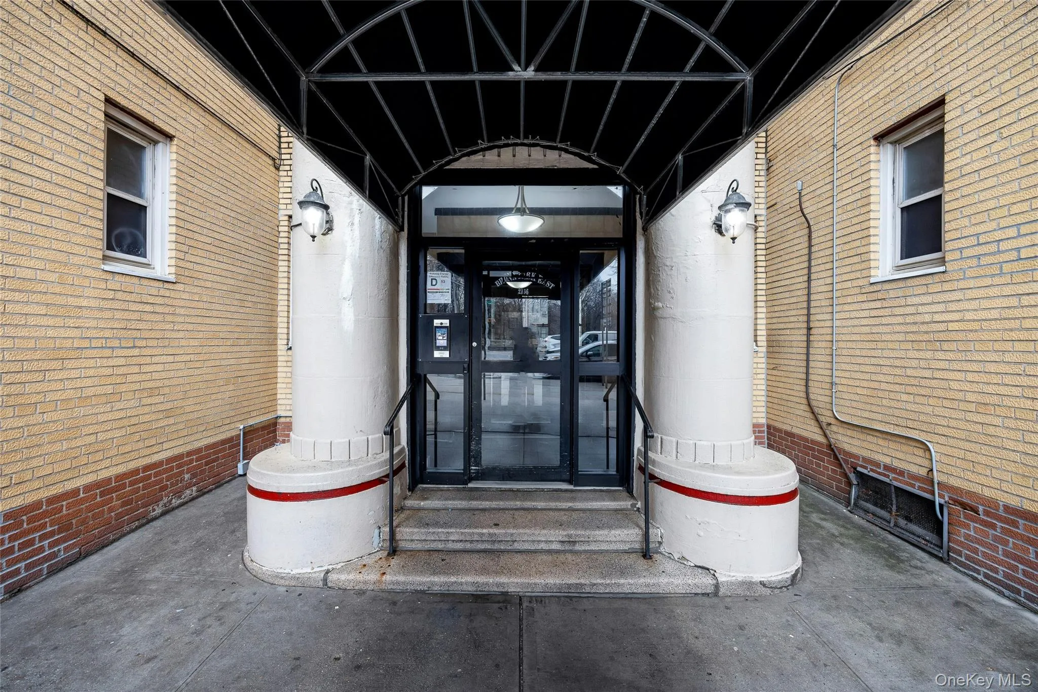 Property entrance featuring brick siding Property entrance featuring brick siding