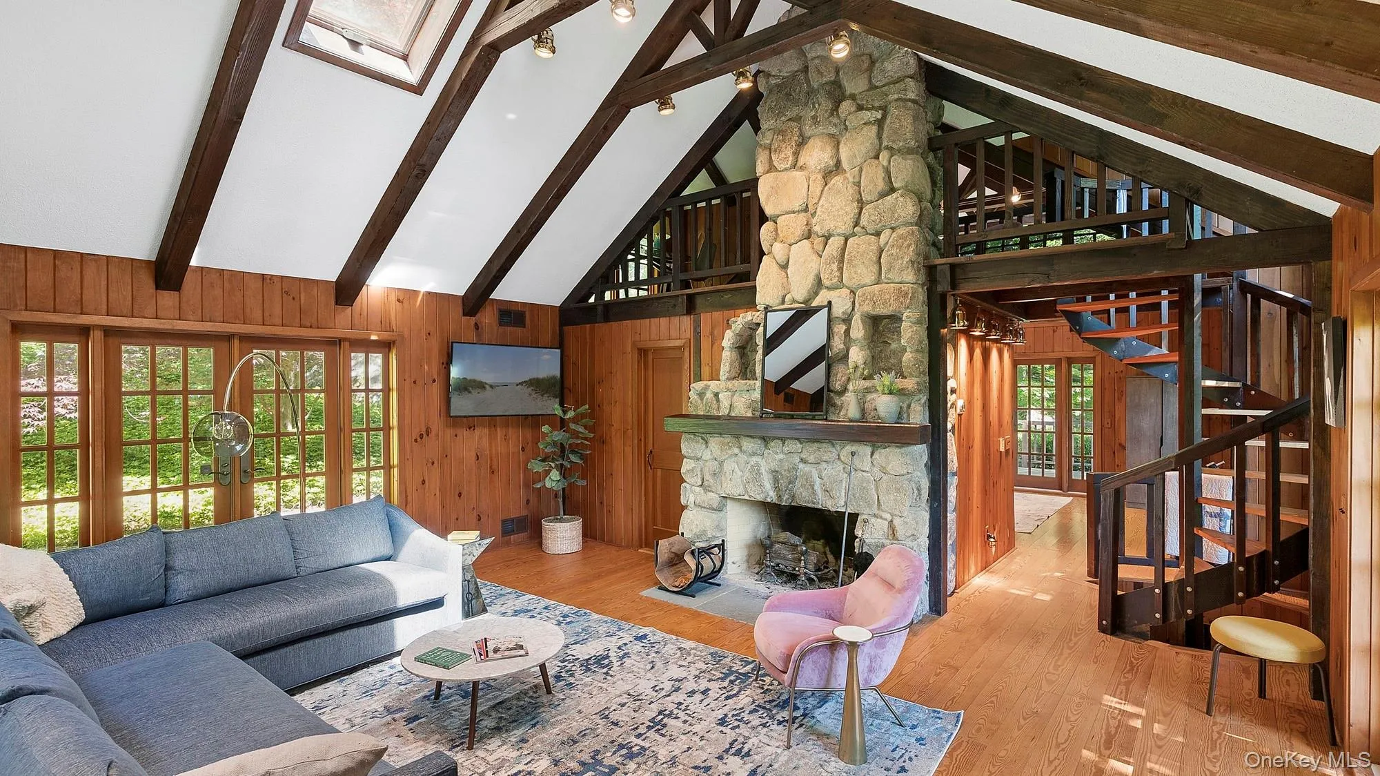 Open floor plan with stone fireplace Open floor plan with stone fireplace