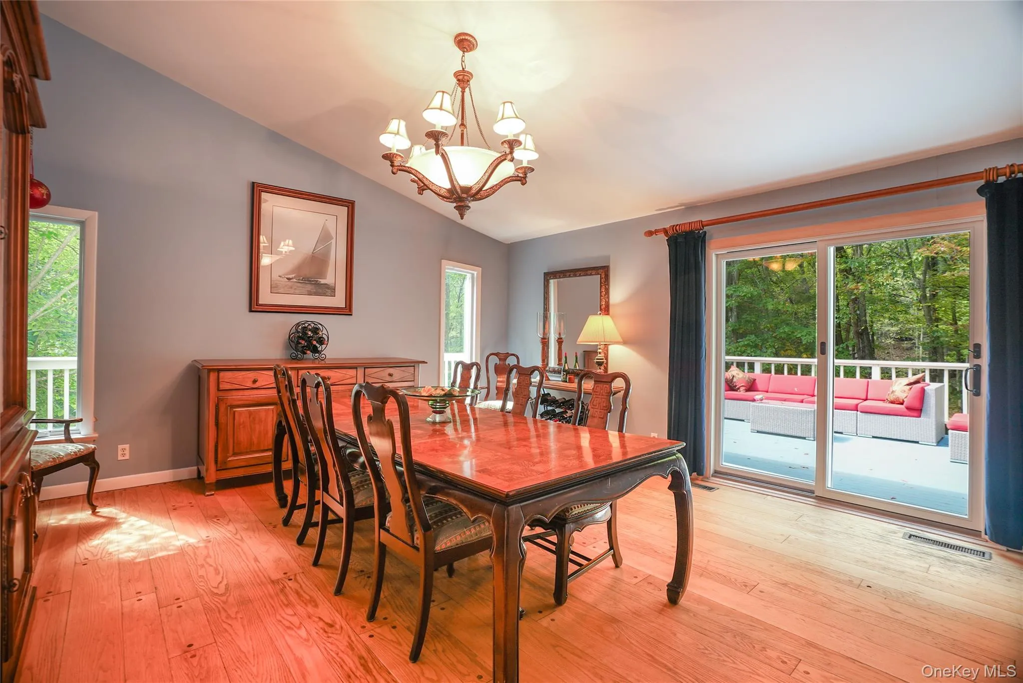 Dining area featuring wood-finish flooring, a vaulted ceiling, and recessed lighting Dining area featuring wood-finish flooring, a vaulted ceiling, and recessed lighting