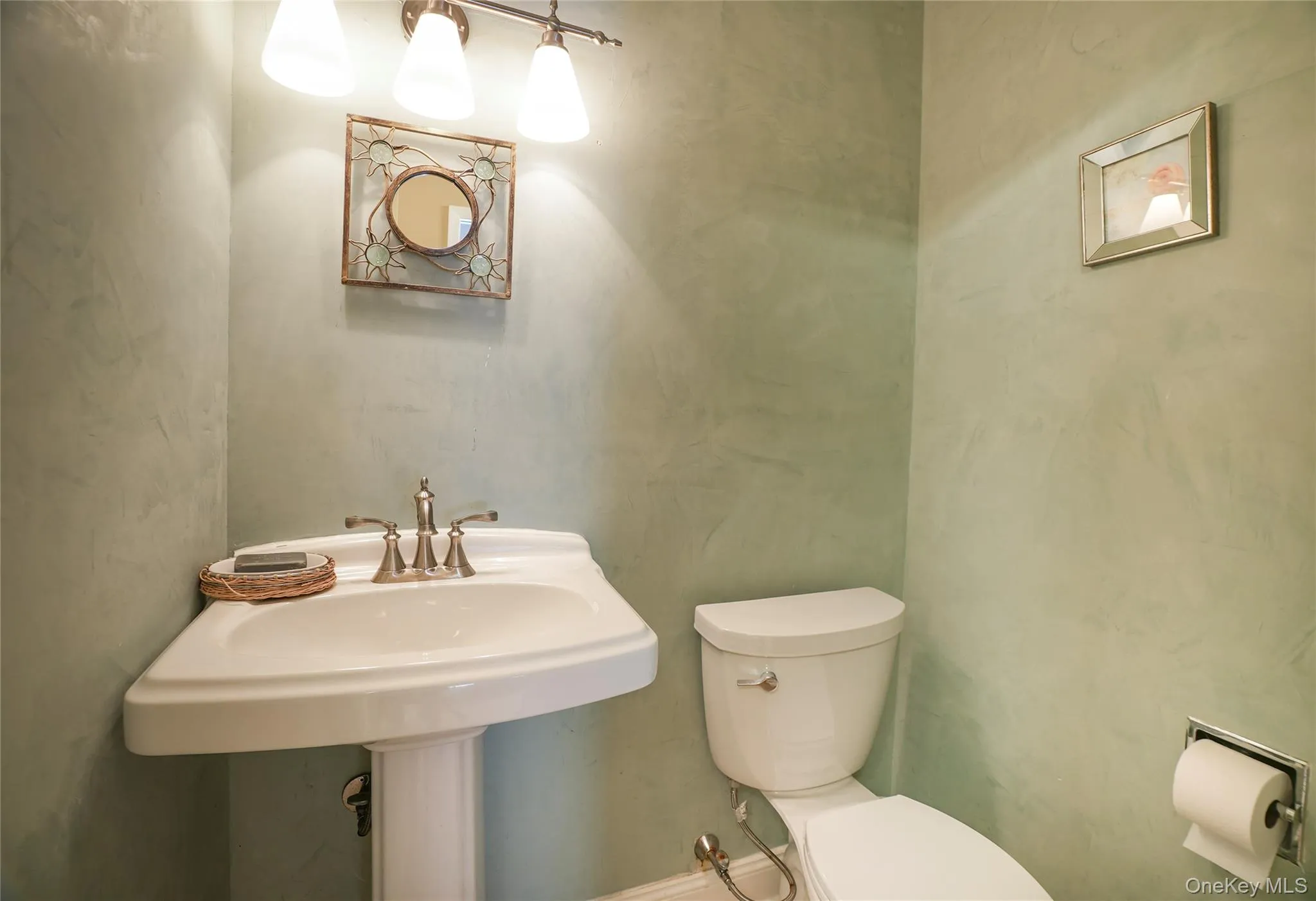Powder room conveniently in the mudroom. Powder room conveniently in the mudroom.