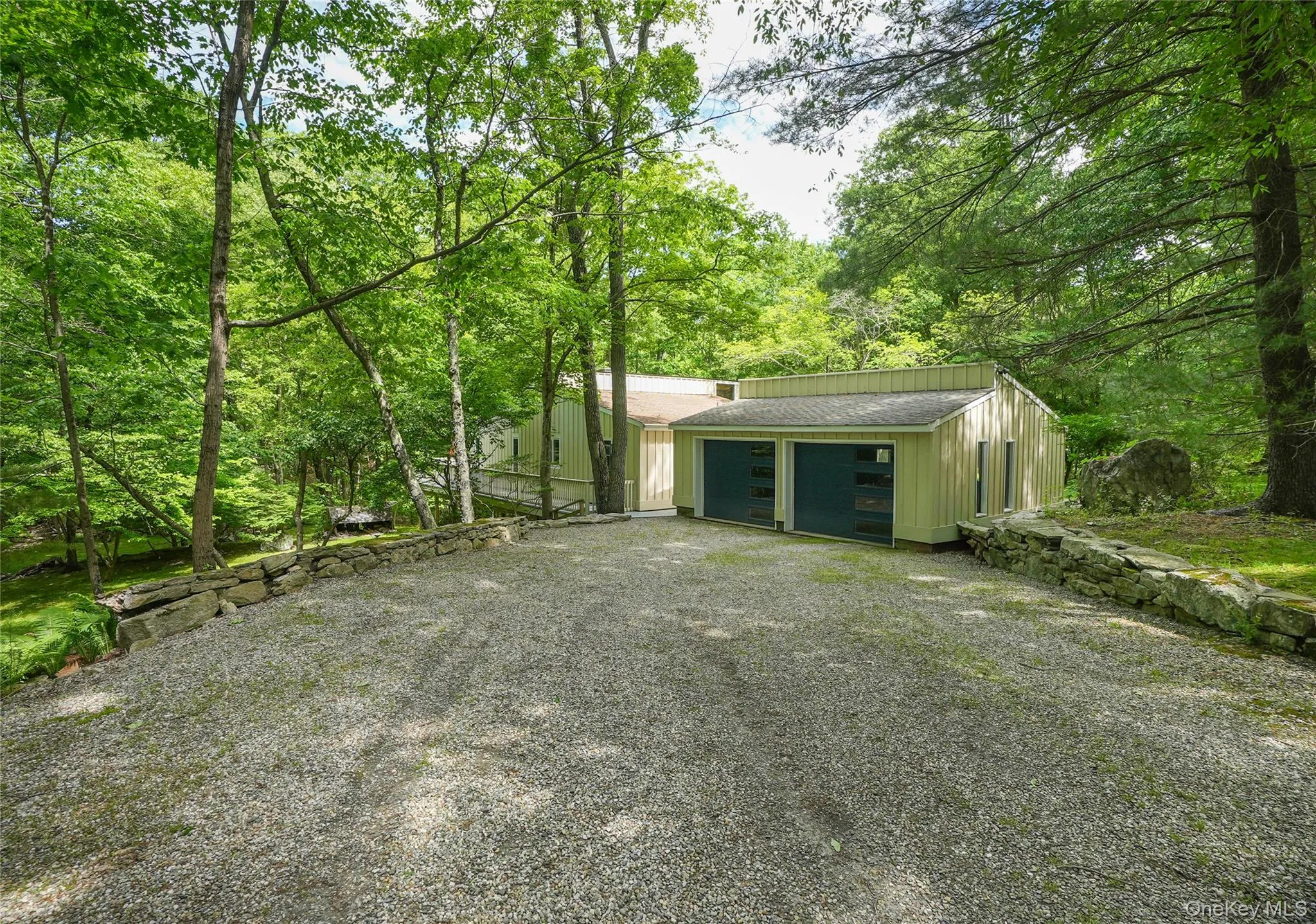 Large driveway w/ 2 car garage. Large driveway w/ 2 car garage.