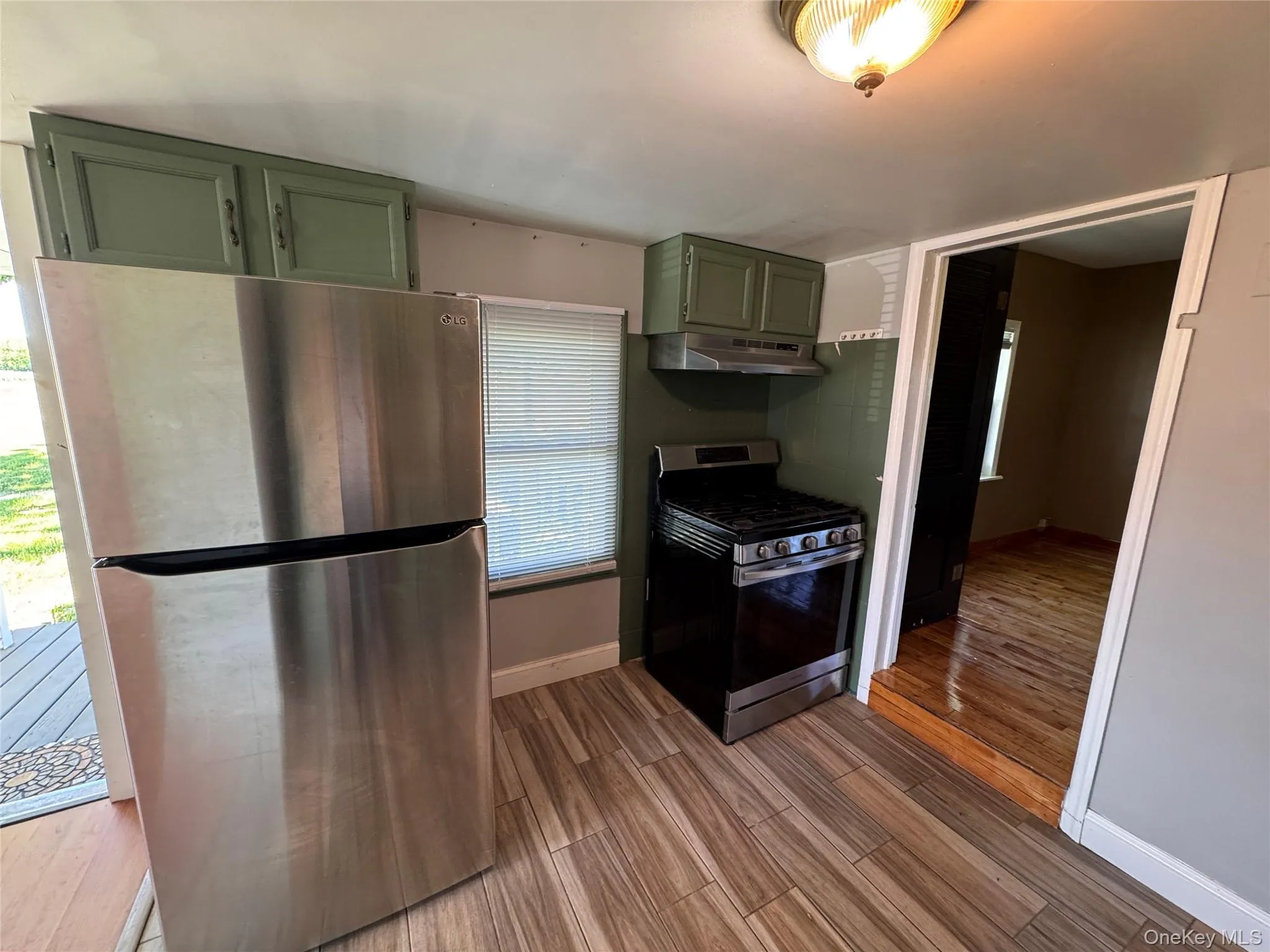 Stainless steel fridge with gas range. Stainless steel fridge with gas range.
